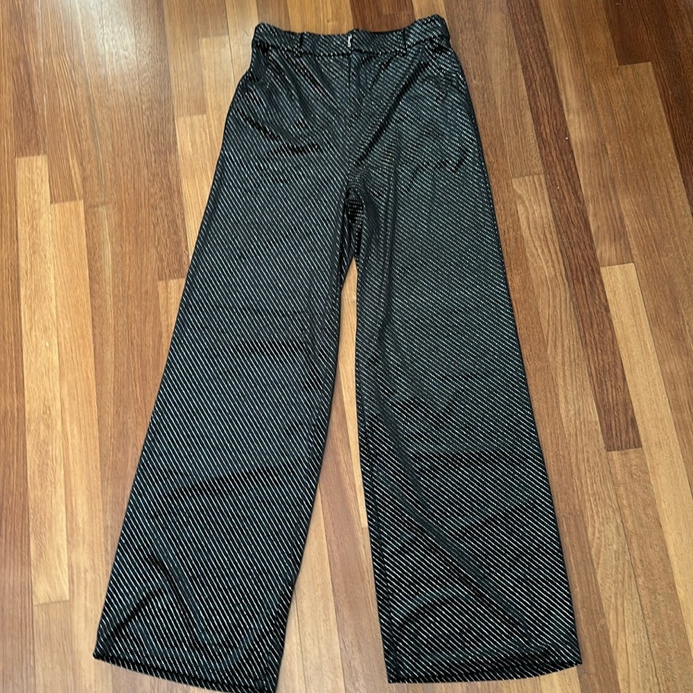 Black polka dot long pants.